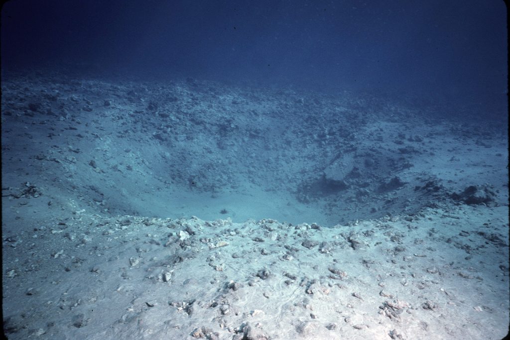 Bomb crater after Navy detonated old ordnance at Molokini in Sept. 1984. 