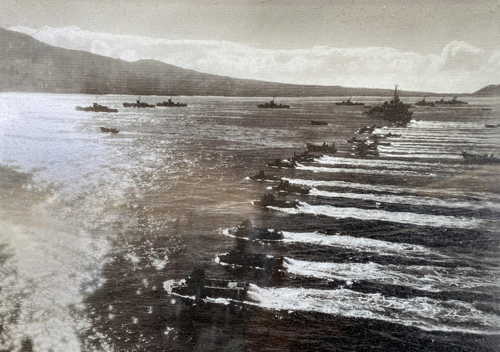 US military ships and amphibious landing vehicles rehearsing amphibious assaults on Maui during WWII